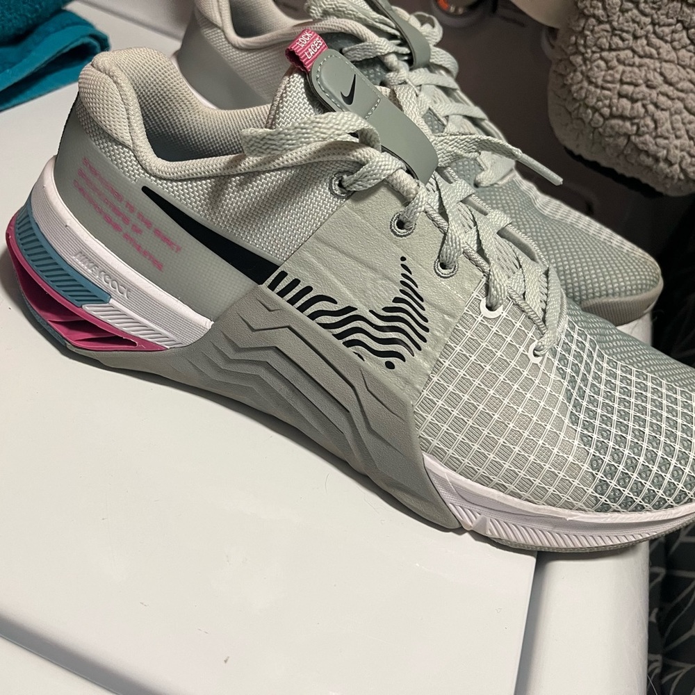 Metcon 8s, only worn in my living room to work out 2 times . Never worn outside.